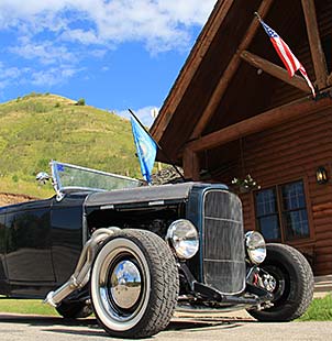 classic car outside lodge